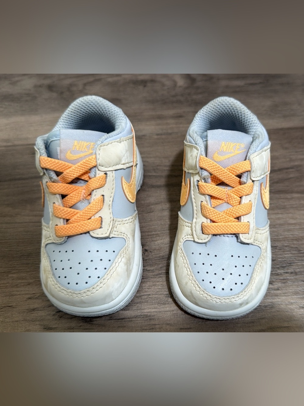 Nike Baby 4C Light Blue & Peach Low-Top Sneakers with Peach Swoosh.